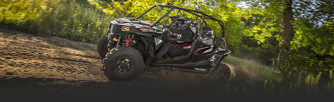 2017 Polaris® RZR 4900 eps runnning in the woods, available in Better Built Trailers, Kansas